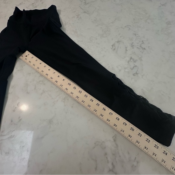 Lululemon Black “Tied to it” High Rise Leggings with mesh/tied ankle detail. - Picture 7 of 13